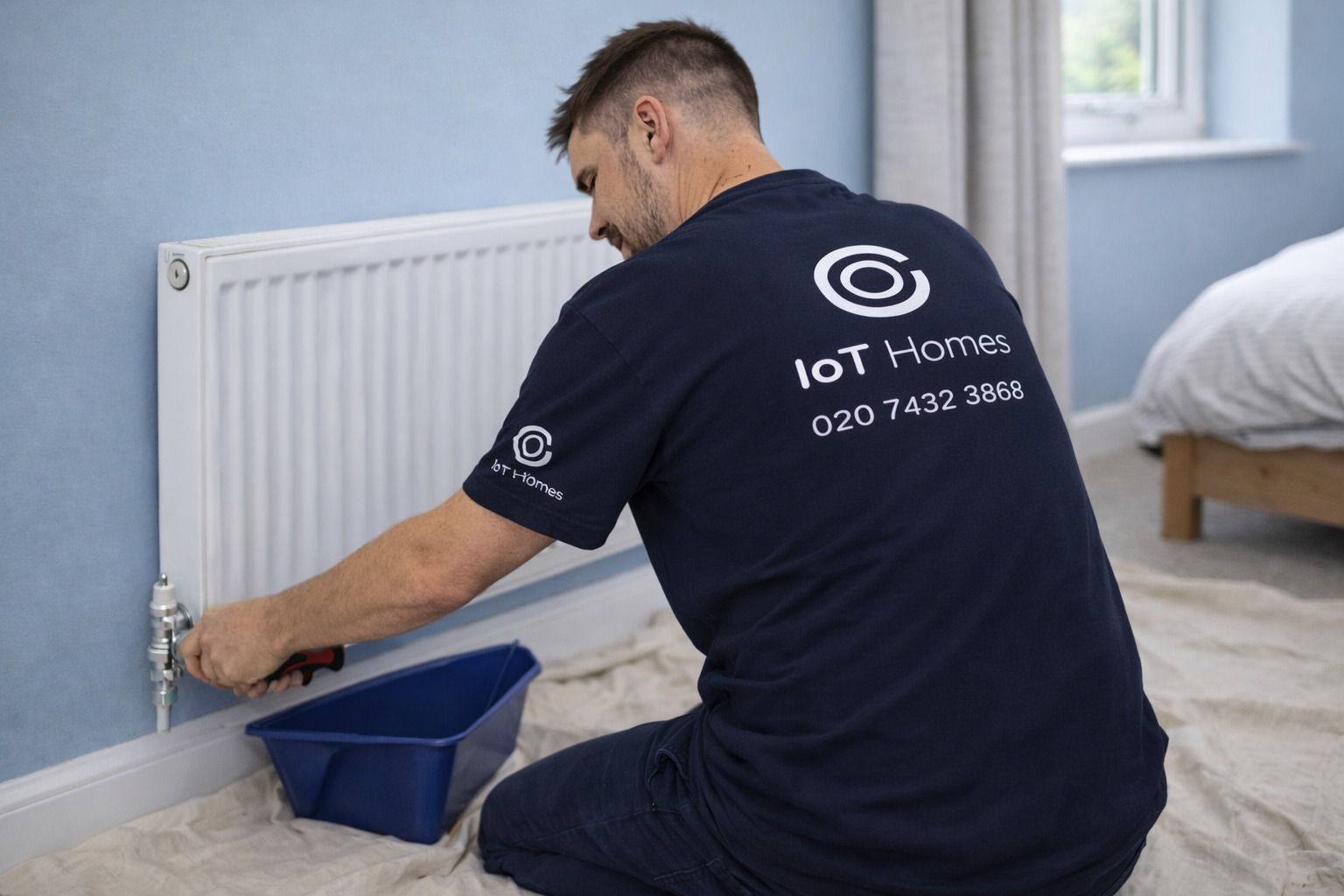 Engineer fixing sink in modern kitchen